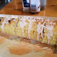 Street Corn · Roasted corn, covered in chipotle cream and cotija.