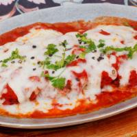 Chicken Or Veal Parmigiana · Side of spaghetti. Dipped in egg and bread crumbs, pan fried covered with parmesan cheese, m...