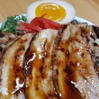Chashu Bowl Deluxe · Marinated cubed chashu and 3pcs of sliced chashu served over rice and topped with green onio...