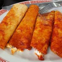 Enchilada Plate · Three red enchiladas topped with lettuce, tomatoes, and sour cream. Served with a side of ri...