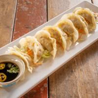 Dumpling · Dumpling stuffed with ground chicken and mixed vegetable. Served with sweet soy vinaigrette.