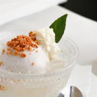 Coconut Ice Cream · Coconut ice cream. Topping with grounded peanut, palm fruit and whipping cream.