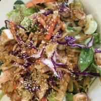 Asian Chicken Salad · Tossed green with sesame seed dressing. Topped with grilled marinated chicken, wonton strips...