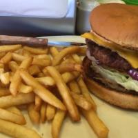 Cheeseburger · Fresh 1/2 pound lean ground beef served with lettuce tomatoes pickles and 1000 island dressi...