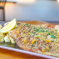 Rainbow Trout · Pan-seared, pepita crust, preserved lemon and butter pan sauce, grilled herb veggies.