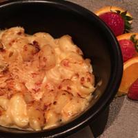 Gourmet Mac & Cheese · Housemade macaroni and cheese topped with golden breadcrumbs. Served with fresh fruit.