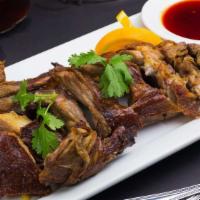 Honey Duckling · Duck marinated in honey and pepper garlic, roasted in a slow oven and deep fried to crispy. ...