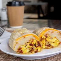 Breakfast Burrito · 2 scrambled eggs, potatoes, bacon and sausage, pico de gallo and cheese. (Choice of rice or ...
