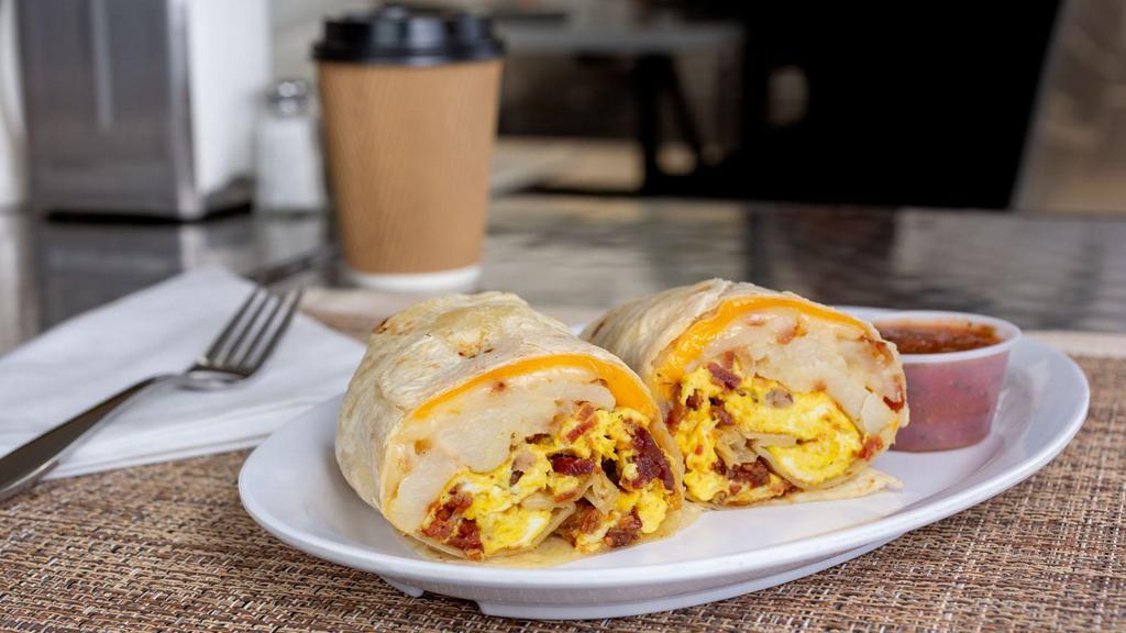 Breakfast Burrito · 2 scrambled eggs, potatoes, bacon and sausage, pico de gallo and cheese. (Choice of rice or beans).