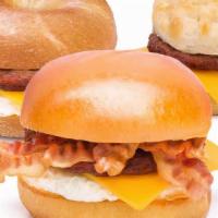 Sausage, Egg & Cheese · Pork or turkey sausage, egg, cheddar cheese, and house spread on your choice of brioche bun,...