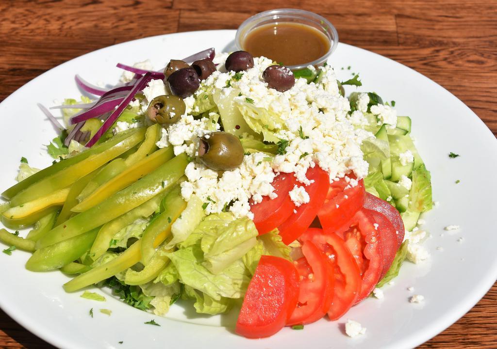 Greek Salad · Gluten-free and vegetarian. Romaine lettuce, spring green mix, Feta cheese, tomato, Persian cucumber, onion, bell peppers and olive with balsamic dressing.
