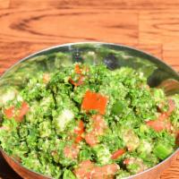 Tabuli Salad · Vegetarian. Chopped Persian cucumber, tomato, parsley and bulgar with lemon dressing.