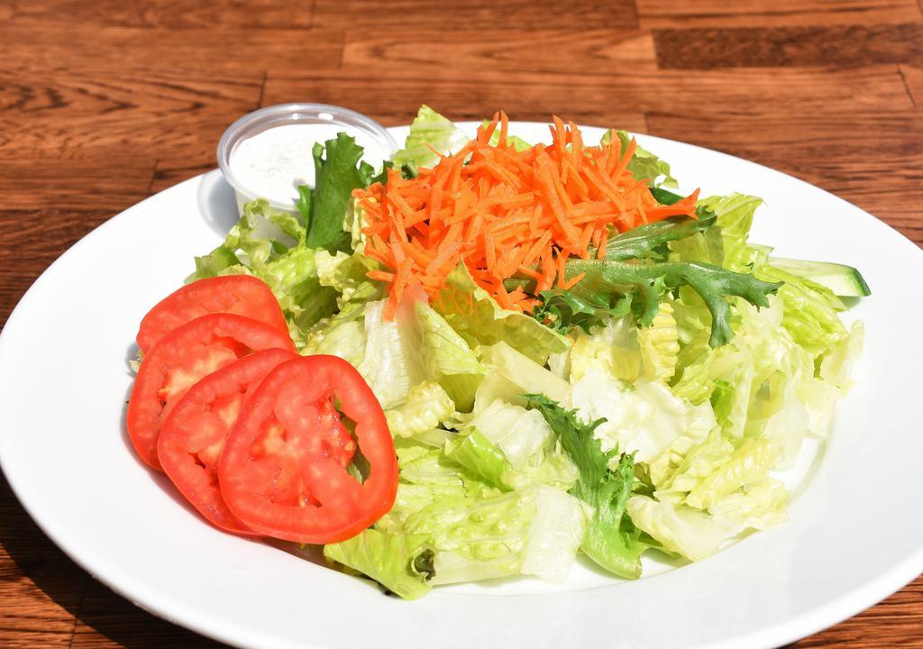 Green Salad · Gluten-free and vegetarian. Romaine lettuce, spring green mix, tomato, Persian cucumber and carrots with a special house dressing.