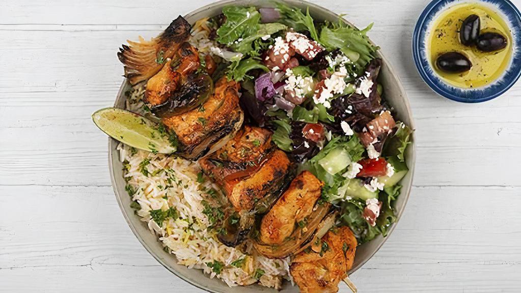 Chicken Kabob Plate · Chargrilled cubes of chicken served with basmati rice, side salad, fresh pita and your choice of sauce.