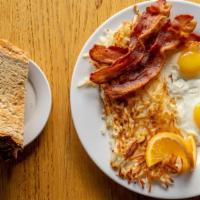 A Flock Of 2 Eggs · served with choice of meat (sausage or bacon), hash browns with toast (sourdough, white, whe...
