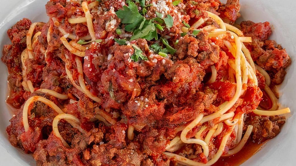 Spaghetti With Meat Sauce · Served with garlic bread.