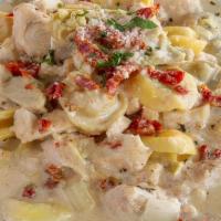 Tortellini & Chicken · Cheese filled tortellini paired with roasted chicken, artichoke hearts, onions and sun-dried...