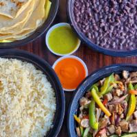 Family Pack - (Serves 5) - Beef · Grilled beef and veggies, rice, beans and 15  tortillas.