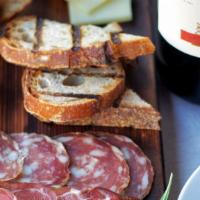 Salumi E Formaggi · Selection of artisanal salumi and Italian cheeses, grilled ciabatta, condiments.