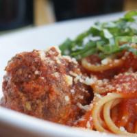Spaghetti E Polpette · Nonna Maria's meatballs, tomato and fresh herb sauce, fresh basil, parmigiano.