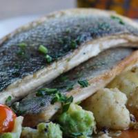 Branzino · Pan seared Mediterranean sea bass fillet, lemon-caper broth, fresh spinach.