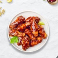 Bbq Bender Wings · Fresh chicken wings breaded, fried until golden brown, and tossed in barbecue sauce. Served ...