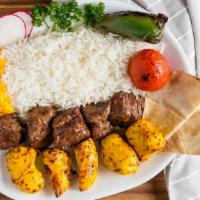 Corner Special Plate · Marinated steak chunks and marinated chicken breast. Served with basmati rice and pita bread...