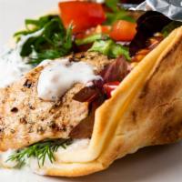 Gyro Wrap · Grilled gyro meat , lettuce , tomato , gyro , yogurt sauce.