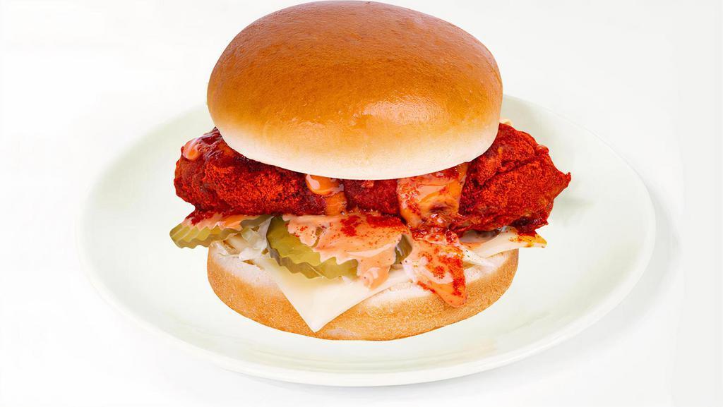 Hot Chicken Sandwich · 100% halal chicken breast, coleslaw, pickles, homemade sauce, and seasoning.