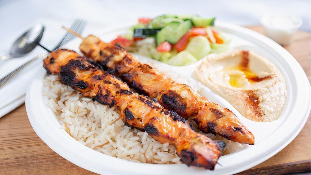 Chicken Thigh Kebab Plate  · Chunks of marinated chicken breast kebab grilled on open flame. Comes with veggies and sauce