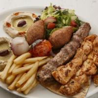 Mix Lule Kebab Plate · Seasoned mix of ground chicken and ground beef/lamb grilled on open flame. Comes with veggie...