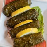 Grape Leaves · Grape leaves stuffed with rice, tomatoes and spice blend.