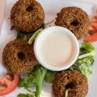 Falafel · Homemade ground garbanzo beans, blend of spices deep-fried served with tahini sauce.