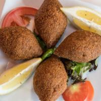Kibbeh Makilyeh · A blend of fresh ground beef, crushed bulgur, onions and pine nuts deep-fried to flavor.