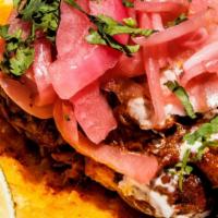 Cochinita Pibil Taco · Pork, Pickled Onion, Cilantro, Mexican Crema, Corn Tortilla