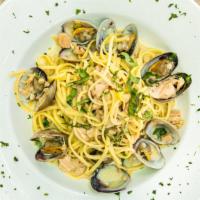 Classic Clams Linguine · Linguine, white wine, clams in shells, finely chopped onions, herbs, lemon, garlic, and choi...