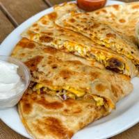 Sausage Breakfast Quesadilla · Cheese Quesadilla filled with scrambled eggs and meat. Comes with a side of Sour Cream and s...