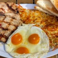 Pork Chops & Eggs · 2 Pork Chops, 3 eggs, hashbrown, and toast