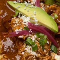 Mole Chicken Nachos · chips, traditional mole sauce topped with shredded chicken, cheddar & jack cheese, pickled o...
