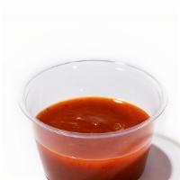 Kimchi Hot Sauce - 2 Oz Side · Aged kimchi, cayenne peppers and vinegar.