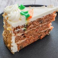 Carrot Cake · Cinnamon cream cheese filling between layers of cake with walnuts and sweet cream cheese fro...