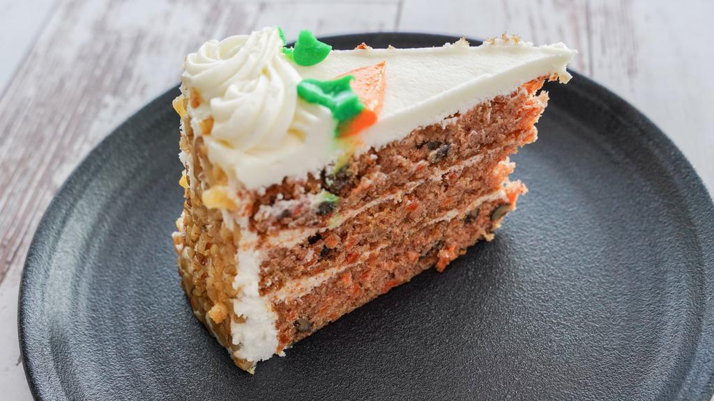 Carrot Cake · Cinnamon cream cheese filling between layers of cake with walnuts and sweet cream cheese frosting.