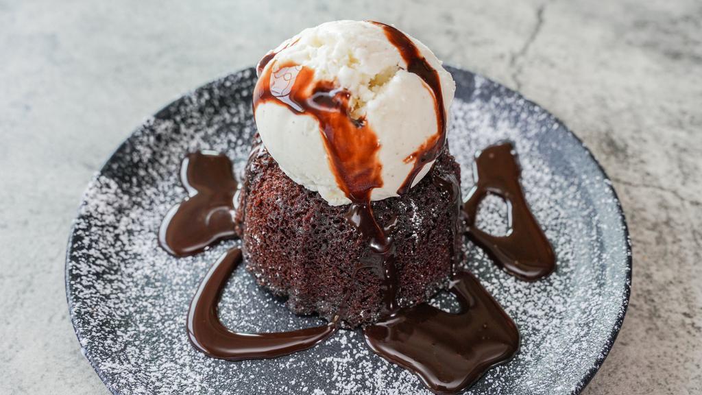 Chocolate Lava Cake · Chocolate cake with fudge filled center served with vanilla ice cream.