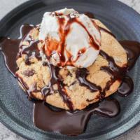The Cookie Monster · A warm chocolate chip or white chocolate macadamia nut cookie topped with vanilla ice cream