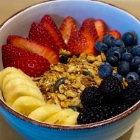 Wellness Granola Bowl · Greek yogurt, granola, seasonal berries, banana and agave.