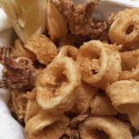 Crispy Calamari · Deep Fried Crispy Calamari with Cocktail Sauce.