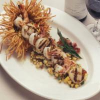 Grilled Sea Scallops And Shrimp · Grilled Scallops & Shrimp Served with Grilled Corn in a Lime Butter Sauce.