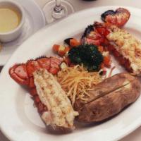 Twin Maine Lobster Tails · (2) Lobster Tails (6 oz. each)  Served with Baked Potato & Sautéed Vegetables.
