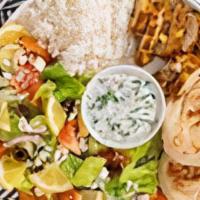 Chicken Shawarma Plate · Tender strips of grilled chicken served with basmati rice, side salad, fresh pita, and a sid...