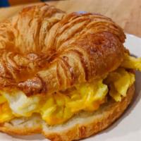 The Breakfast Croissant  · Buttery toasted croissant with scrambled eggs and melted cheddar cheese. Add a Protein to ma...